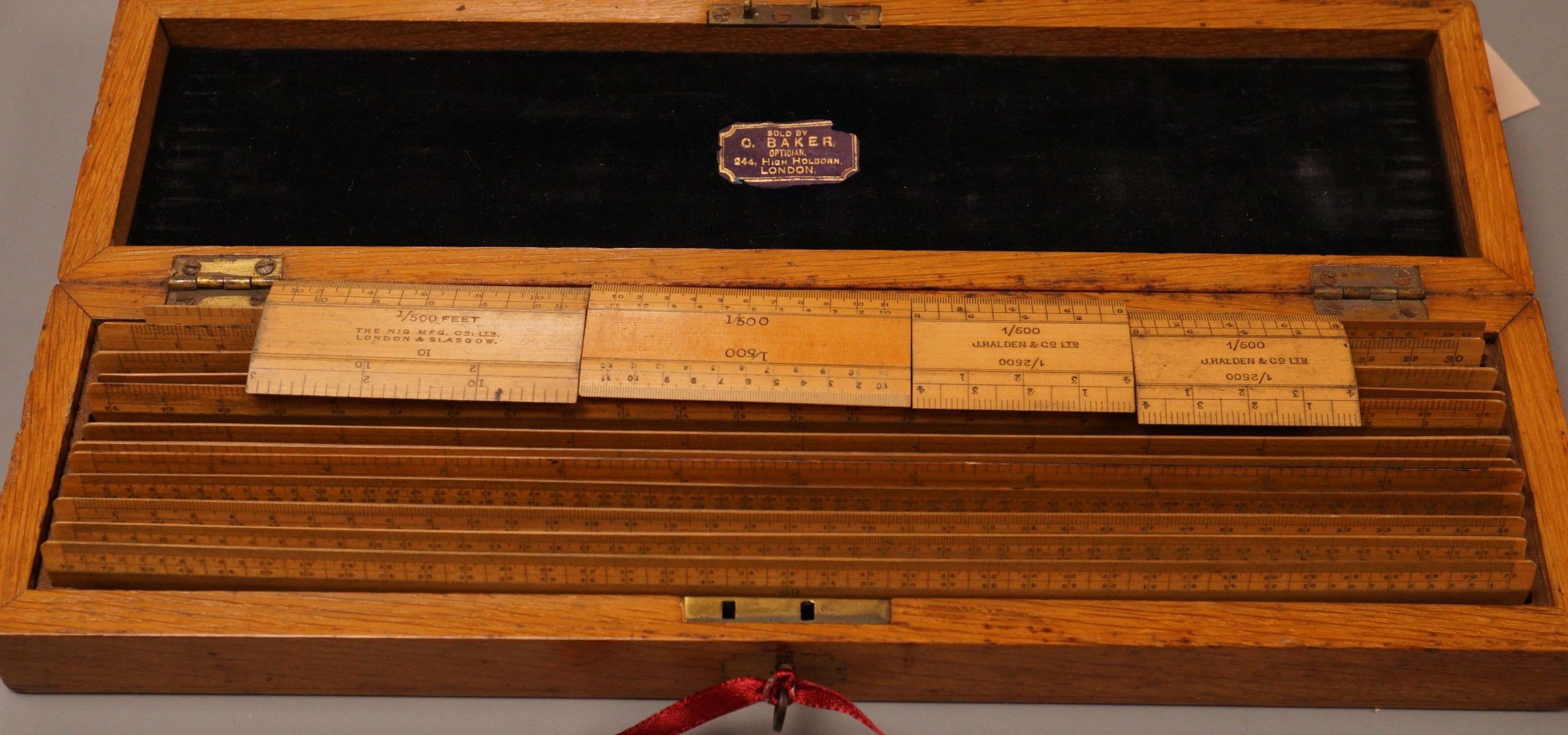 An oak cased set of draughtsman's rules